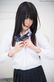 Shinjo nozomi unbuttoning her uniform shirt long hair framing her cute face