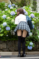 Bending over to smell flowers in uniform upskirt panties