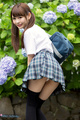 Looking back hair in pigtails wearing pleated skirt panties exposed