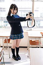 Standing in classroom taking selfie in uniform