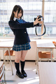 Standing in classroom taking selfie in uniform
