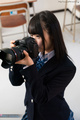 Student looking through viewfinder in classroom