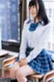 Momoki nozomi seated on school desk in uniform.jpeg