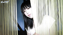 Machiko looking through curtains long hair