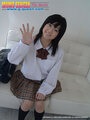 Kogal momo komori sitting on couch wearing uniform white shirt plaid skirt dark blue socks.jpg