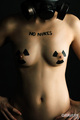 Topless with small breasts hands on hips