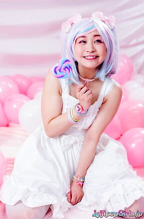 Minano Ai on her knees sucking lolipop and cock