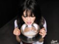 Holding dish cum in her mouth