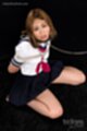 Kogal on her knees wearing uniform bondage chain