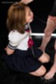 On her knees wearing uniform bondage chain