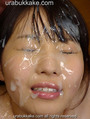 Yui with her face drenched in bukkake cum.jpg
