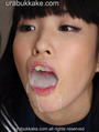 Gokkun cumshots filling her open mouth.jpg