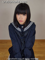 Kogal kneeling on floor wearing seifuku uniform.jpg