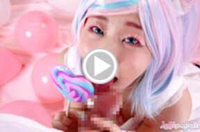 Minano Ai on her knees licking lollipop and sucking cock