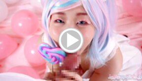 Minano Ai on her knees licking lollipop and sucking cock